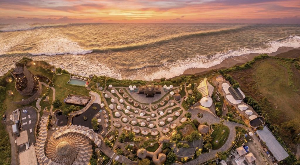 Aerial sunset view of LUNA Beach Club in Nuanu Creative District, Bali.